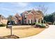 Brick two-story home with manicured landscaping and traditional architectural details at 359 Flatstone Sw Way, Marietta, GA 30064