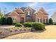 Brick two-story home with manicured landscaping and traditional architectural details at 359 Flatstone Sw Way, Marietta, GA 30064