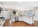 Well-lit kitchen boasts white cabinetry, stainless steel appliances, and a view into the living area at 359 Flatstone Sw Way, Marietta, GA 30064