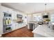 Beautiful kitchen showcases white cabinets, stainless steel appliances, a large island, and quartz countertops at 359 Flatstone Sw Way, Marietta, GA 30064