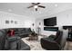 Open-concept living room featuring a large leather sectional and a fireplace at 359 Flatstone Sw Way, Marietta, GA 30064