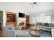 Bright living room features built-in shelving, fireplace, vaulted ceiling, and plush seating arrangement at 359 Flatstone Sw Way, Marietta, GA 30064