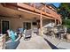 Beautiful outdoor living space with ceiling fans, grill, stone bar, and comfortable seating at 359 Flatstone Sw Way, Marietta, GA 30064