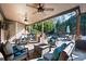 Covered outdoor patio offering comfortable seating and outdoor ceiling fans at 359 Flatstone Sw Way, Marietta, GA 30064