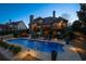 Beautiful backyard with a sparkling pool, a spacious deck, and scenic nighttime landscape at 359 Flatstone Sw Way, Marietta, GA 30064