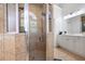 Tiled shower with glass door in the bathroom with dual sink vanities at 359 Flatstone Sw Way, Marietta, GA 30064