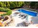 Aerial view of swimming pool and patio area, with BBQ and seating at 359 Flatstone Sw Way, Marietta, GA 30064