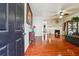 A view from the doorway into the large living room with hardwood floors and fireplace at 2926 Greyhawk Ln, Cumming, GA 30040