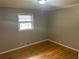 Cozy bedroom featuring natural light and hardwood floors at 403 Colchester Dr, Stone Mountain, GA 30088