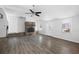 Sunlit living room with vaulted ceilings, hardwood floors, and a lovely stone fireplace at 6235 Ridge Rd, Hiram, GA 30141