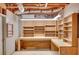 Unfinished basement with exposed ceiling, workbench and shelving at 1139 Tennyson Ne Pl, Brookhaven, GA 30319