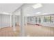 Spacious basement with tile floor, white support posts and glass doors at 1139 Tennyson Ne Pl, Brookhaven, GA 30319