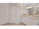 Bathroom with double vanity, granite countertop, and ample cabinet space at 1139 Tennyson Ne Pl, Brookhaven, GA 30319