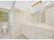 Bright bathroom with a large mirror, white cabinetry, and double vanity offers a fresh, clean feel at 1139 Tennyson Ne Pl, Brookhaven, GA 30319