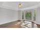Inviting bedroom with hardwood floors, neutral walls, and bay window with outdoor views at 1139 Tennyson Ne Pl, Brookhaven, GA 30319