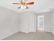 Neutral bedroom with a ceiling fan and view to another room at 1139 Tennyson Ne Pl, Brookhaven, GA 30319