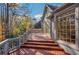 Exterior view of deck showcases home's architectural details and lovely outdoor living space with wooded scenery at 1139 Tennyson Ne Pl, Brookhaven, GA 30319