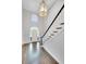 Bright, two-story foyer with hardwood floors, staircase, and grand chandelier creates an impressive entrance at 1139 Tennyson Ne Pl, Brookhaven, GA 30319