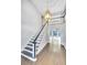 Two-story foyer featuring dark-stained staircase, hardwood floors, and chandelier with views of the living space at 1139 Tennyson Ne Pl, Brookhaven, GA 30319