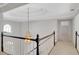 Hallway with decorative chandelier and a view through an arched window at 1139 Tennyson Ne Pl, Brookhaven, GA 30319