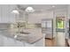 Well-equipped kitchen with stainless steel appliances, granite countertops, and white cabinets at 1139 Tennyson Ne Pl, Brookhaven, GA 30319