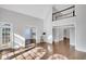 Bright living room with soaring ceilings, wood floors, and open access to the rest of the house at 1139 Tennyson Ne Pl, Brookhaven, GA 30319