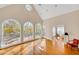 Bright room featuring cathedral ceiling, multiple windows that offer an abundance of natural light and hardwood floors at 1139 Tennyson Ne Pl, Brookhaven, GA 30319