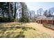 Expansive backyard with mature trees and lush lawn, perfect for outdoor activities and relaxation at 1276 Kingsview Se Cir, Smyrna, GA 30080