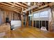 Unfinished basement space with exposed framing, windows, and natural light at 1276 Kingsview Se Cir, Smyrna, GA 30080
