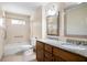 Bathroom with double sinks, granite countertops, and a shower-tub combination at 1276 Kingsview Se Cir, Smyrna, GA 30080