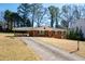 Lovely single-story brick home with a carport and a long driveway at 1276 Kingsview Se Cir, Smyrna, GA 30080