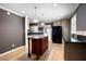 Bright kitchen featuring a center island, stainless steel appliances, and hardwood floors at 1276 Kingsview Se Cir, Smyrna, GA 30080