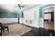 Living room with white built-in shelving and doorways leading to other rooms at 1276 Kingsview Se Cir, Smyrna, GA 30080