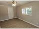 Bright and airy bedroom featuring a closet and a large window at 147 Mildred Ct, Dallas, GA 30157