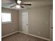 Cozy bedroom featuring ceiling fan, neutral walls, and light-colored flooring at 147 Mildred Ct, Dallas, GA 30157
