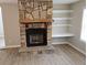A stone fireplace with a raised hearth and custom-built shelves at 147 Mildred Ct, Dallas, GA 30157