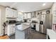 Modern kitchen with stainless steel appliances, granite countertops, and a stylish kitchen island at 2114 Fellowship Rd, Tucker, GA 30084