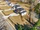 Stunning aerial view of a modern two-story home with a spacious lot, driveway, and three-car garage at 2551 Kilgore Rd, Buford, GA 30519