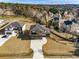 Expansive aerial view of a modern two-story home featuring a spacious lot, driveway, and two-car garage at 2551 Kilgore Rd, Buford, GA 30519