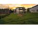 Modern home with many windows, an outdoor deck, and a well-manicured lawn at 2551 Kilgore Rd, Buford, GA 30519