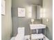 Modern powder room featuring designer fixtures and elegant decor at 2551 Kilgore Rd, Buford, GA 30519