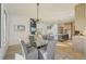 Spacious dining area open to the living room features a decorative chandelier for ambiance at 2551 Kilgore Rd, Buford, GA 30519