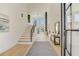 Inviting foyer with soaring ceilings, hardwood floors, and contemporary staircase design at 2551 Kilgore Rd, Buford, GA 30519
