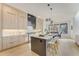 Modern kitchen with island, stainless steel appliances, and eat in dining, perfect for cooking and entertaining at 2551 Kilgore Rd, Buford, GA 30519