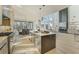 Modern kitchen with eat-in dining, stainless steel appliances, and open layout to living area at 2551 Kilgore Rd, Buford, GA 30519