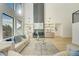 Spacious living room with hardwood floors, tall windows, and modern built-ins at 2551 Kilgore Rd, Buford, GA 30519