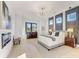 Luxurious main bedroom featuring a contemporary chandelier and modern fireplace at 2551 Kilgore Rd, Buford, GA 30519