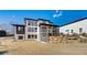 View of the rear of the house and backyard, featuring a porch and walk out basement at 2551 Kilgore Rd, Buford, GA 30519