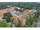 Aerial view of new townhome community in a neighborhood featuring sidewalks, landscaping, and green spaces at 121 Priestwood Ln, Acworth, GA 30102