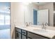 Bathroom featuring a double sink vanity with gray cabinets and white countertop next to a bedroom at 121 Priestwood Ln, Acworth, GA 30102